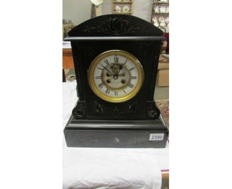 An Edwardian black slate mantel clock by H Norris, Paris with open escapement movement.