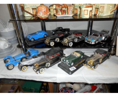 4 x radios in form of vintage cars and 6 model cars in varying conditions by Burago etc.