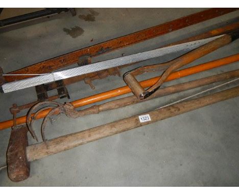 A quantity of G clamps and garden tools.
