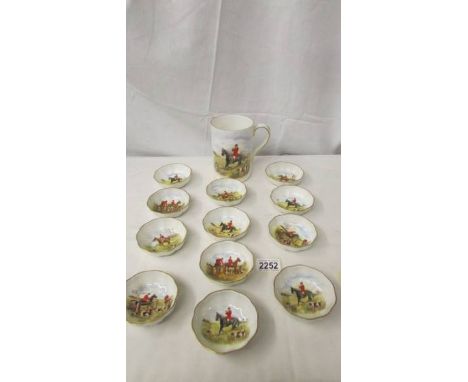 A Royal Crown Derby hunting scene tankard and 12 matching pin dishes.