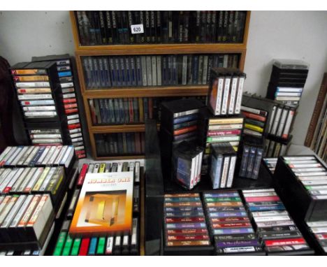4 vintage cassette holders with doors, and other holders plus over 300 cassette tapes, mostly pre-recorded, but a good lot of