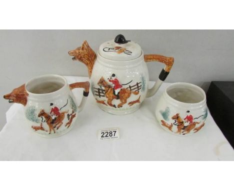 A three piece fox hunting tea set.