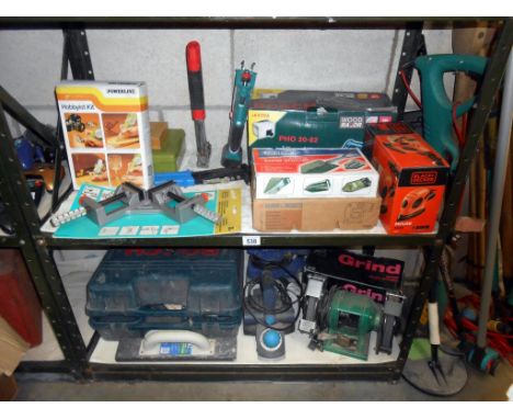 Quantity of hand tools on 2 shelves such as bench grinder, Bosch planer, orbital sander drill bits, stapler, etc