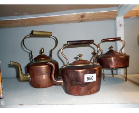 3 vintage copper kettles and a trivet (one has a brass handle)