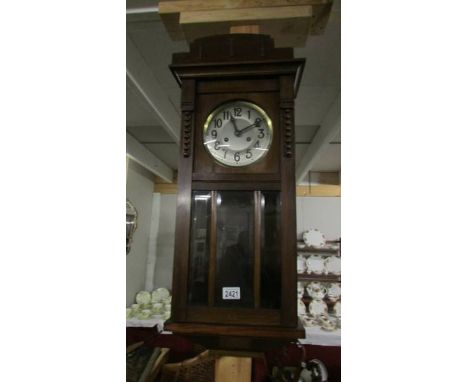 An 1930's oak wall clock