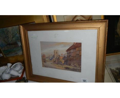 A framed and glazed watercolour village scene signed W R Burrows.