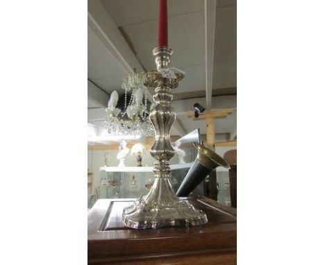 A 19th century ornate silver plate candlestick.