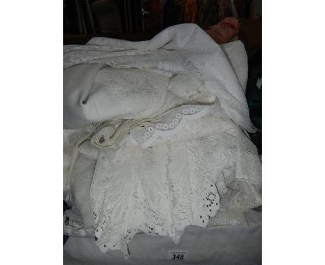 A large quantity of white linen, net curtains etc.,