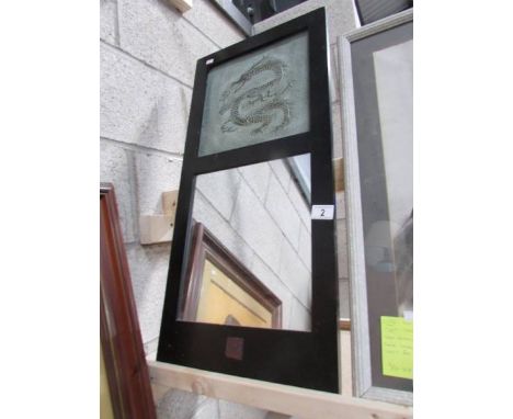 A dark framed mirror dragon tile in top and Chinese symbols.  75 x 36 cm.