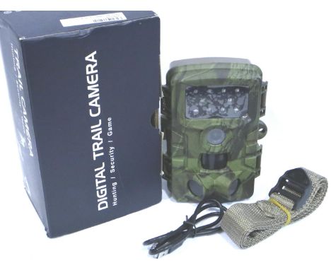 New old stock digital Trail camera. PIR/CMOS sensor has very light scratch, 5MP camera: no make/model, appears unused but box