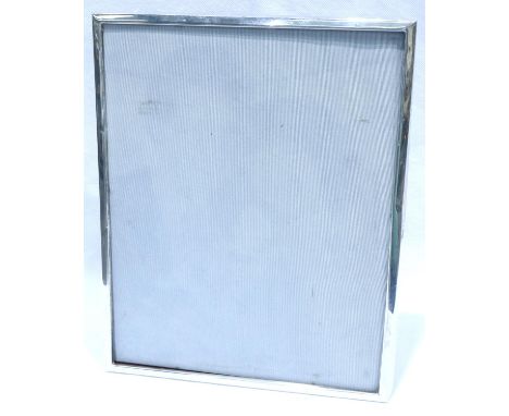 Hallmarked silver photograph frame, 21 x 26 cm. P&amp;P Group 2 (£18+VAT for the first lot and £3+VAT for subsequent lots) 