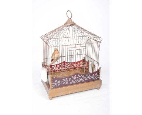 A late Victorian/Edwardian birdcageOf typical form with etched cranberry glass panels to the exterior, twin milk glass bird f