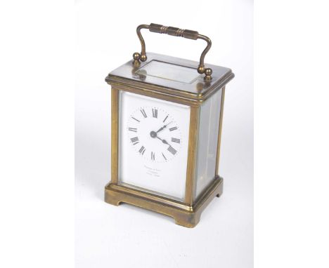 A French 19th Century carriage clockThe four glass clock set within brass corniche case with white enamel dial and black Roma