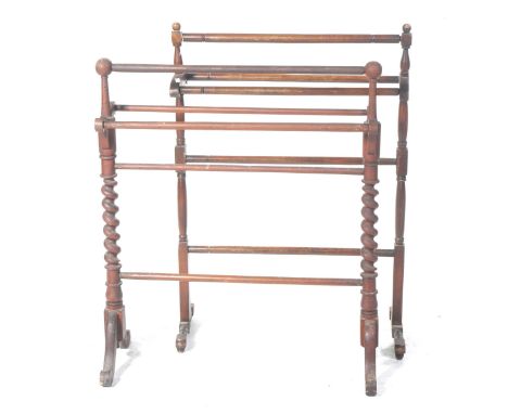 Two Victorian stained beechwood towel railsThe first with barley twist uprights and spherical finials and the second a ring t