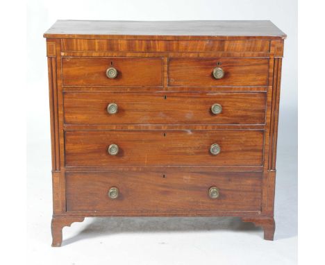 A George IV mahogany chest of drawersWith a rectangular top above a secret frieze drawer over two short and three long cockbe