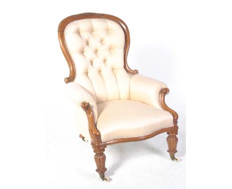 A Victorian balloon back mahogany framed drawing room chairHaving a padded button back within a scroll mahogany frame above p