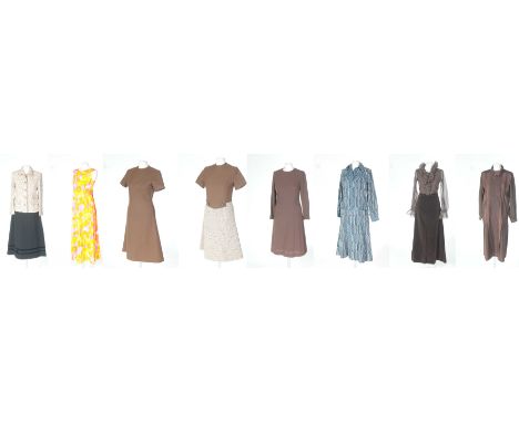 A collection of vintage 1960s/70s ladies fashionTo include two 1960s brown dresses, a Chanel style wool jacket, a black wool 