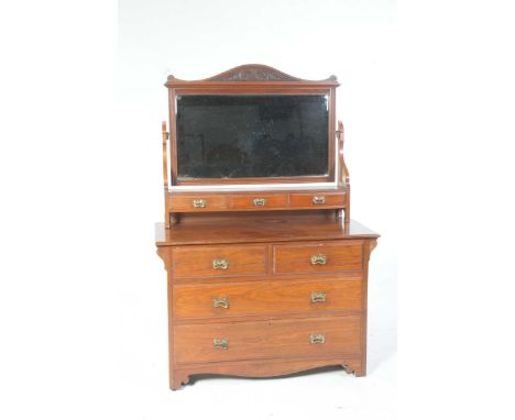 A late Victorian mahogany dressing table by Ralph Johnson, WarringtonThe rectangular mirror with an arched carved pediment ab