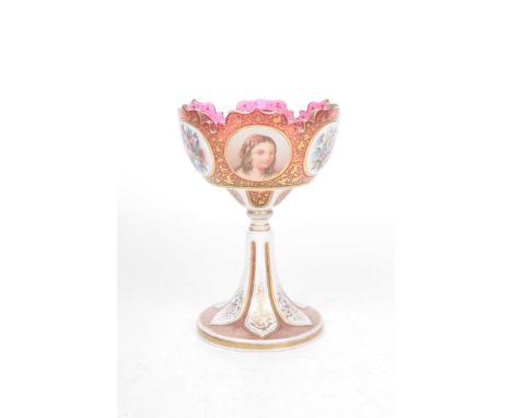 A late 19th Century Bohemian overlay glass pedestal vaseThe Cranberry glass cut with milk glass overlay and upper scalloped r