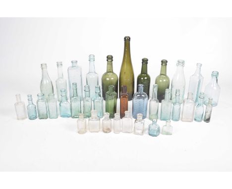 A collection of early to mid 20th Century beer bottles and further glass bottlesTo include examples from Wrexham Lager Beer C