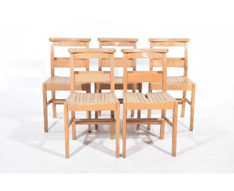 A set of five beechwood chapel chairsEach chair with a rail back and rear book trough, raised on tapering legs of square sect