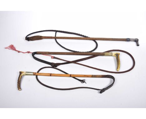 A collection of early to mid 20th Century hunting whips The first with bamboo stick and braided single leather tail adorned w