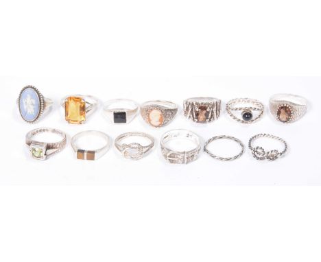 A quantity of silver ringsTo include; a silver and tiger's eye ring, a silver and wedgewood ring, a silver and cameo ring, wi