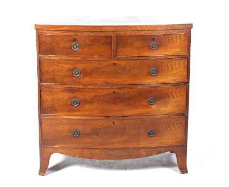 An early 19th Century mahogany bowfront chest of drawersWith an arrangement of two short over three long cockbeaded drawers e