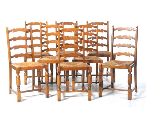 A set of eight 18th Century style stained oak and beech ladder back dining chairsEach chair with a four rung back above a dro