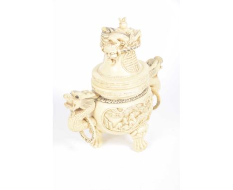 A Chinese simulated ivory censer The tripod censer extending to a domed base carved with shou symbols further detailed with t