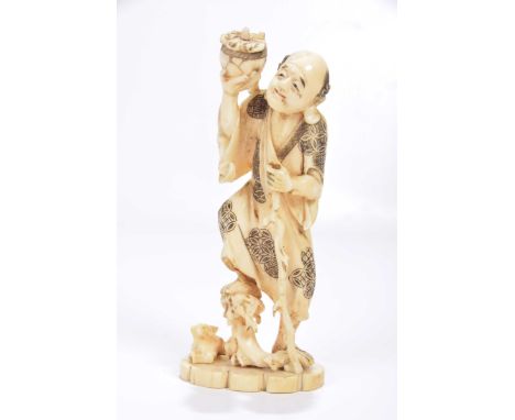 A Japanese carved ivory Okimono, late Meiji periodThe figure modelled as an elderly sage holding a gnarled stick, with foot r