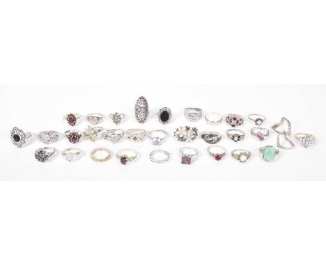 A quantity of silver ringsTo include; a silver and marcasite ring, a silver and imitation jade ring, a silver and garnet clus