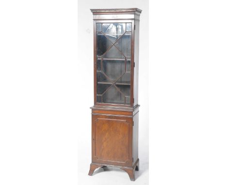 An early 20th Century Georgian style freestanding display cabinetWith a Greek key pattern cornice above a single astragal gla