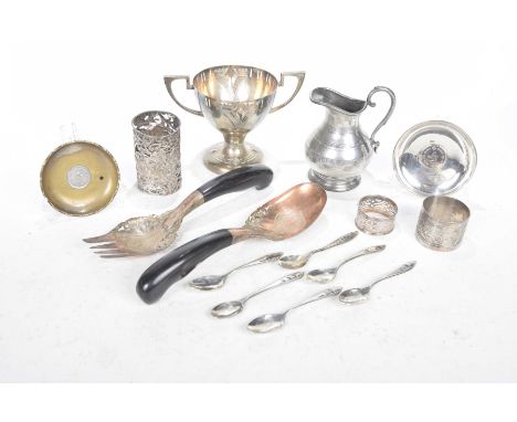 A collection of plated and white metal itemsTo include a two handled cup with angled handles, a silver cylindrical openwork s