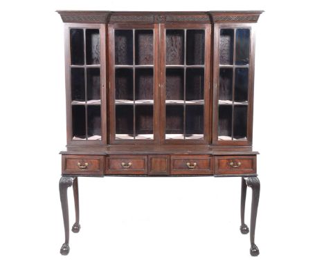 A Chinese Chippendale Revival mahogany display cabinet, early 20th CenturyThe inverted breakfront display cabinet with a blin