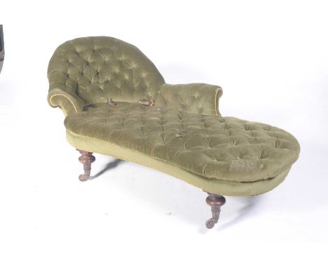 A Victorian velour chaise loungeWith an arched button back above a button down padded seat, raised on knopped and turned legs