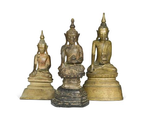 A group of three Burmese bronze Shan State Buddha figures, 19th century, each with domed cranium, crowns and robes, 26.5cm, 2