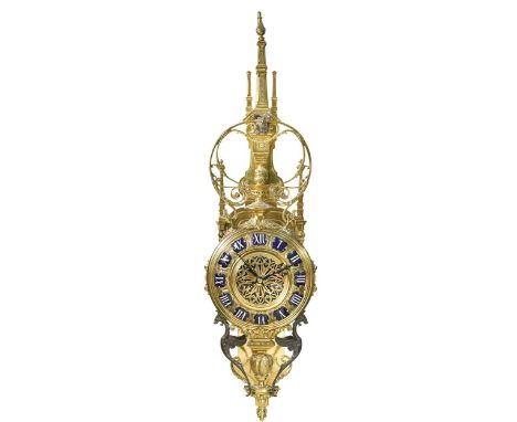 A French gilt brass wall clock in Gothic style, early 20th century, the elaborate case with bronze bird perched above the pro