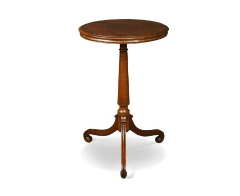 A William IV mahogany tripod table, the circular top on a turned support with three scrolled legs73 x 47cm
