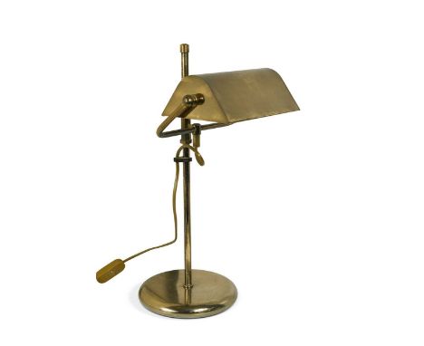 A banker's style brass desk lamp, late 20th century, the shade adjustable for angle and height raised on a cylindrical stem a