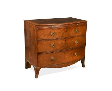A Regency mahogany and crossbanded bow front chest, with brushing slide over three long drawers on splayed bracket feet82.5 x