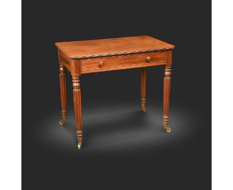 A mahogany chamber writing table, in the manner of Gillows, 19th century, the rounded rectangular top with reeded edge and li