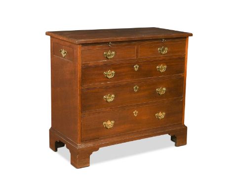 A George III mahogany bachelors chest, the brushing slide above two short and three long drawers, with a single drawer to eac
