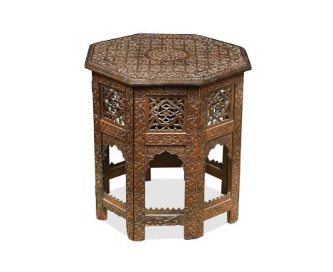 A Hoshiapur teak occasional table, Indian early 20th century, the top profusely carved with foliate motifs around a central p