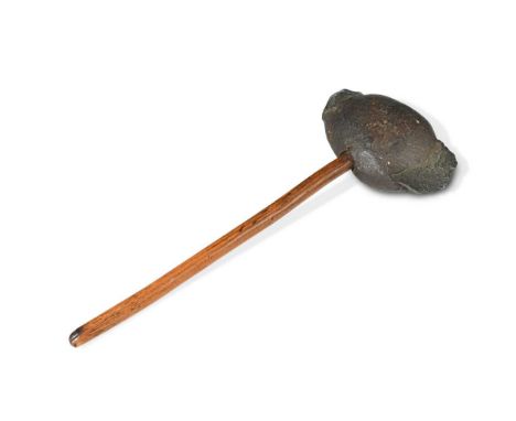 A primitive stone axe head, likely of American origin with ash or hickory shaft11 x 7cm head30cm long overallProvenance:Given