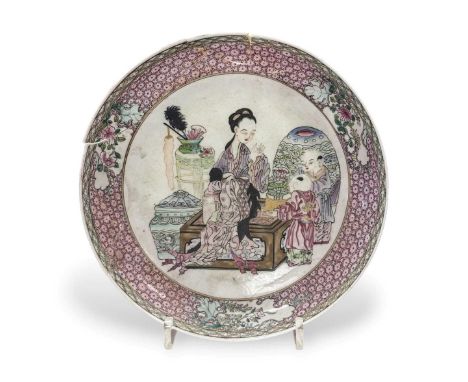 A Chinese ruby backed polychrome enamelled shallow bowl, Yongzheng Emperor (1722-1735), depicting a girl playing with two chi