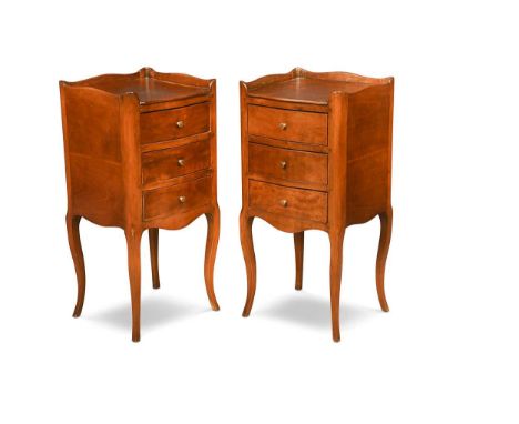 A pair of vintage French provincial cherrywood bedsides, the tray tops above three drawers set with brass pulls and slight se