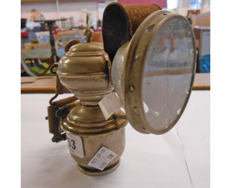 A vintage aceteline bicycle lamp - crack to lens