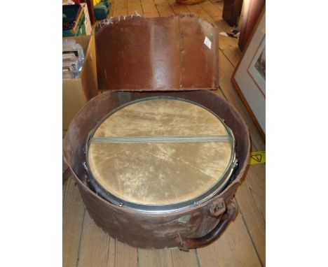 A vintage jazz snare drum and hi-hat cymbal, both in travelling cases