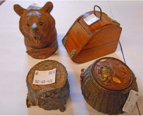 Four novelty inkwells comprising Japanese fish basket, carved Black Forest Villars bear's head, coal box pattern and metal tr